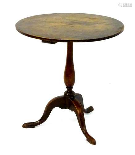 A 19thC country tripod table with a circular mahogany