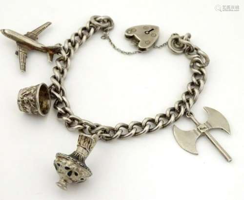 A silver charm bracelet set with silver and silver