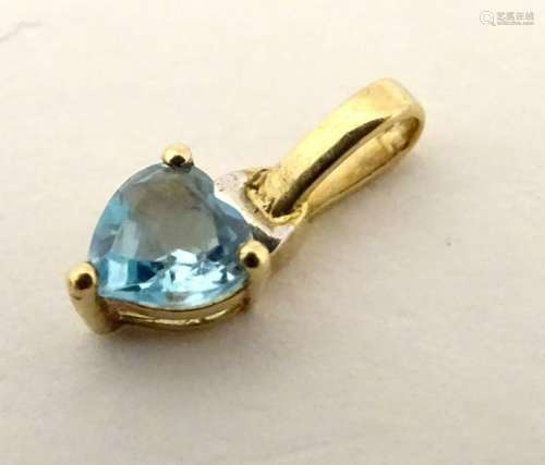 9ct gold pendant / charm set with heart shaped topaz.