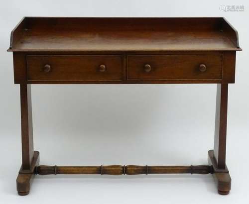 A mid 19thC mahogany wash stand with a shaped up stand