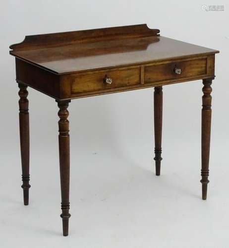 A mid 19thC mahogany side table with a shaped up stand