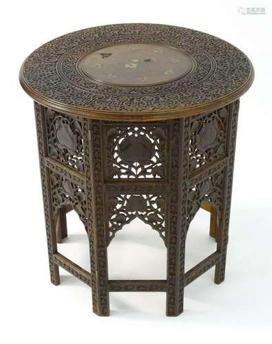 A late 19thC folding table with a circular top having