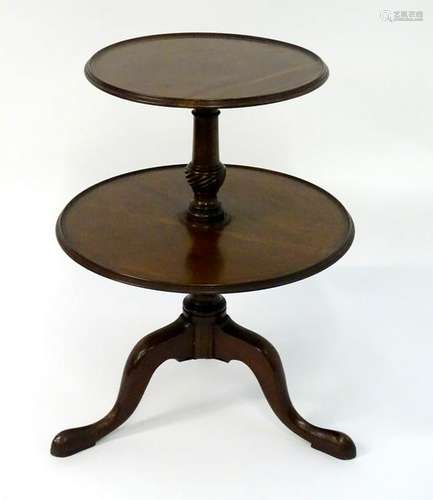 A Georgian two tier mahogany dumb waiter with a