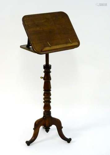 A late 19thC mahogany reading stand with an adjustable