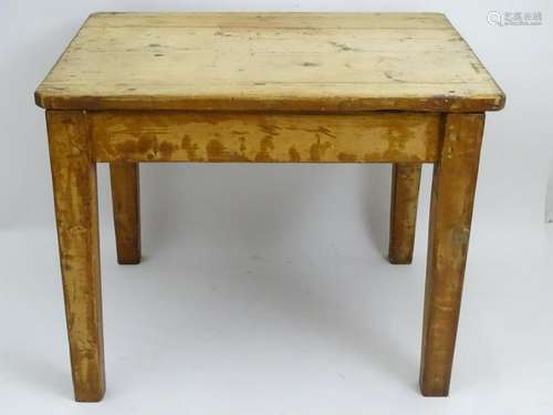 A Victorian pine table with a rectangular top above