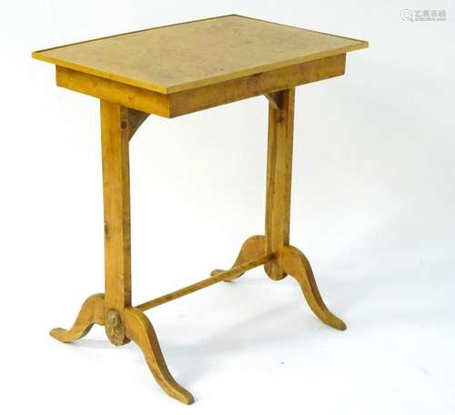 An early 20thC fruit wood side table with single frieze