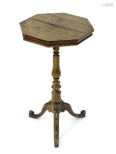 A 19thC rosewood octagonal table with a turned stem and