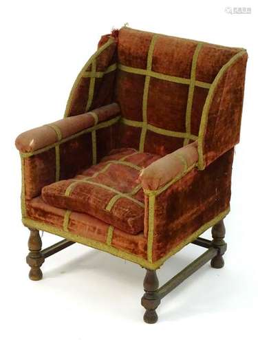 A late 19thC / early 20thC childs wingback armchair