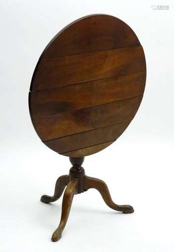 A late 18thC tripod occasional table with a cherry wood