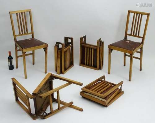 A set of six American 'Leg-o-matic' folding chairs,