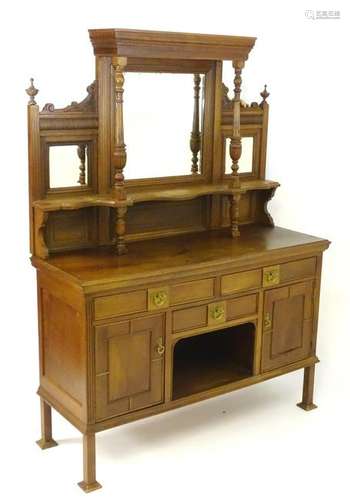 A late 19thC walnut mirror back sideboard with a