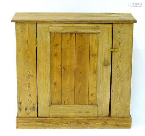 A late 19thC pine cupboard with a rectangular top above