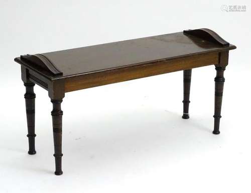 An Edwardian mahogany window seat / bench with applied