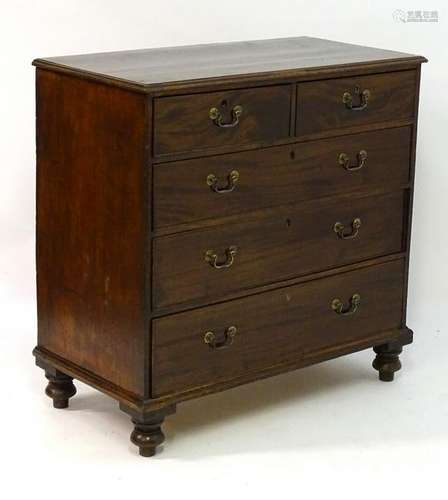 A Victorian mahogany chest of drawers with a