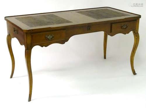 A mid / late 20thC writing desk, inset with two