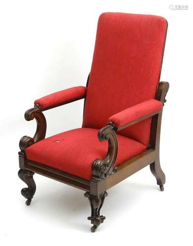 A Victorian mahogany reclining open armchair with