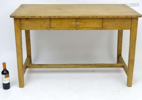 A late 19thC pine French table, having a rectangular