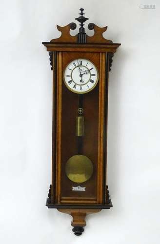 A late 19thC walnut cased Vienna regulator wall clock