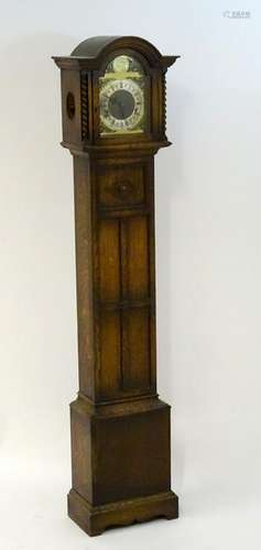 Oak grandmother clock: A musical sprung 3 train 7 3/4''