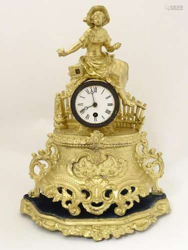 French gilt painted spelter mantel clock: a circular 30