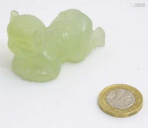 A Chinese carved jade figure formed as a baby crawling,