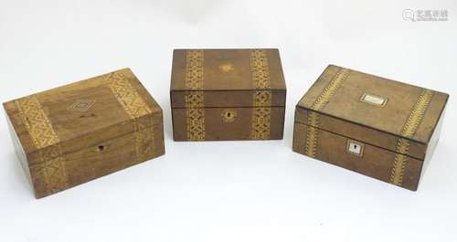 Three assorted walnut and marquetry banded boxes, the