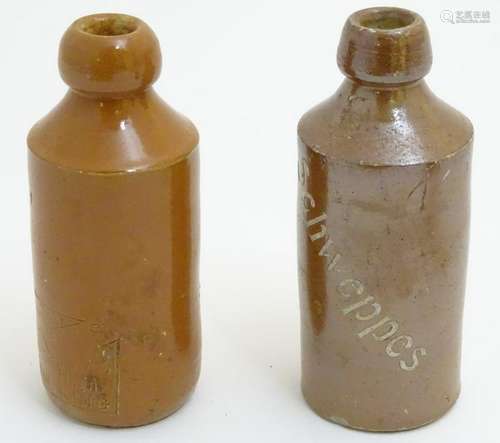 Two stoneware bottles, one marked Schweppes, the other