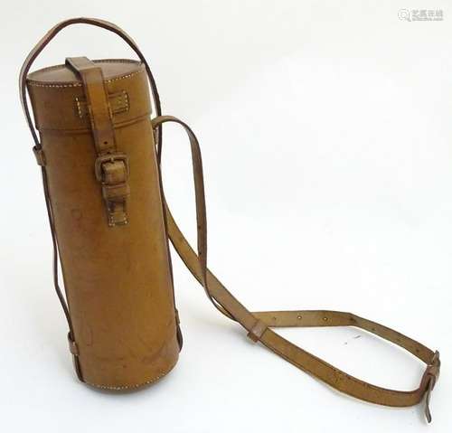 A lidded leather flask case of cylindrical form with a