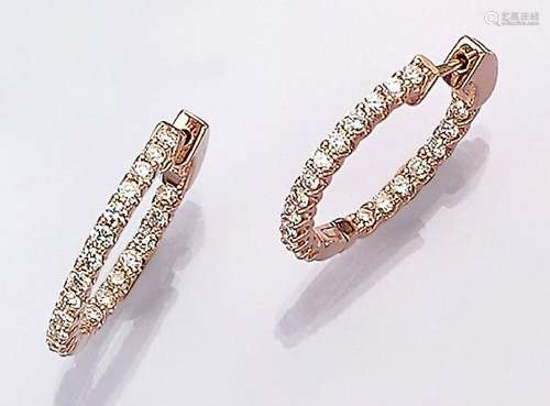 Pair of 14 kt gold hoop earrings with brilliants