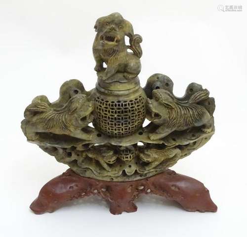 A 19thC Asian carved soapstone reticulated lidded bowl,