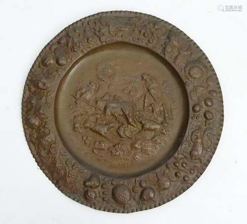 A 19thC Continental brass relief charger depicting stag