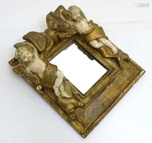 A contemporary wall mirror with gilt and cream