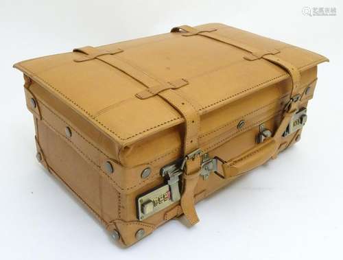 A pig skin expandable case with a combination lock and