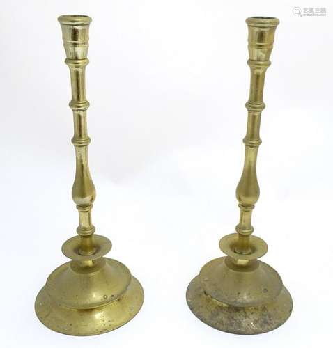 Tall Candle Sticks: a pair of 19thC Continental cast