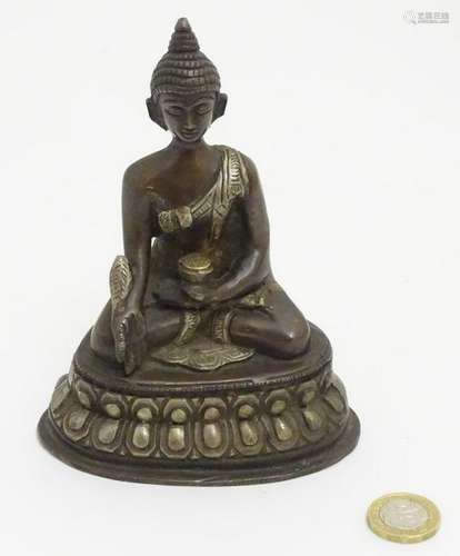 Medicine Buddha: a cast bronze Nepalese Buddha sat