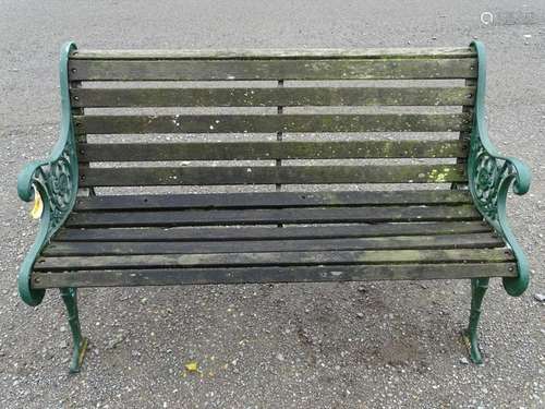 Garden bench: a teak and green painted cast iron 2 seat