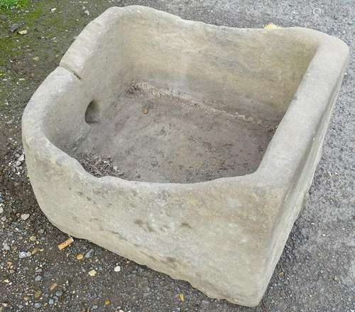 An 18thC sandstone trough with a hole to front. Approx.