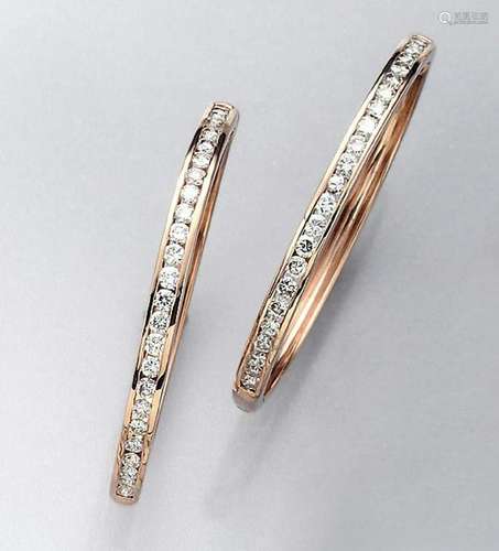 Pair of big 14 kt gold hoop earrings with brilliants