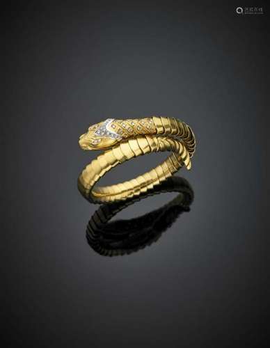 Yellow gold snake bangle accented on the head with