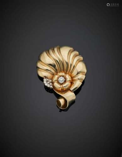 Yellow gold and volute brooch accented with diamonds,