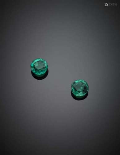 Two round ct. 2.75 and ct. 2.88 emeralds. Appended