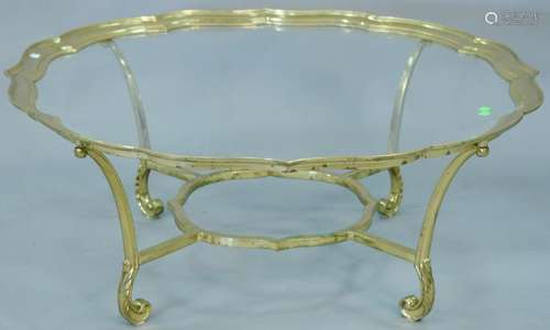 Brass trimmed glass coffee table. ht. 16 1/2 in., dia.