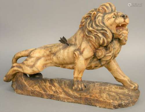 Large marble figure of a lion with arrow in its side,