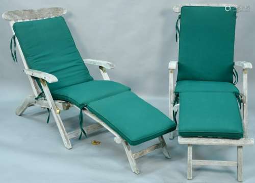 Pair of teak folding chairs or chaises.