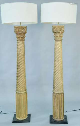 Pair of carved wood columns made into floor lamps.