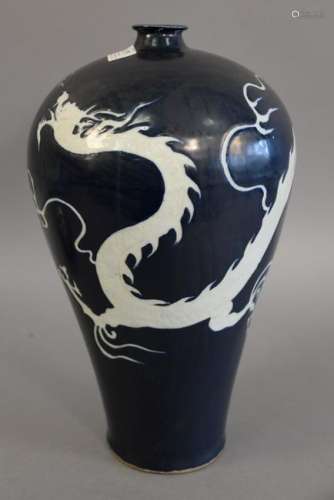Blue glazed dragon vase having deep blue glaze with