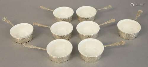 Eight sterling silver ramekins with porcelain liners.