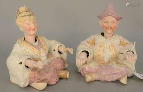 Porcelain male and female nodder figures, polychrome