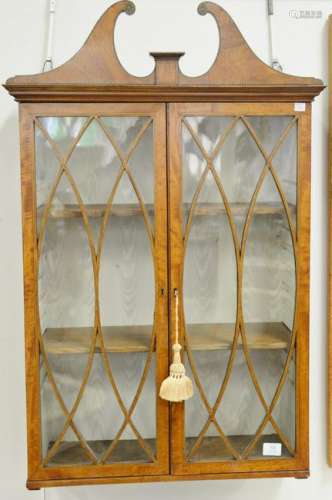 Hanging curio cabinet with cloth interior and