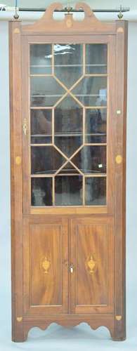 Custom mahogany inlaid corner cabinet having roken arch